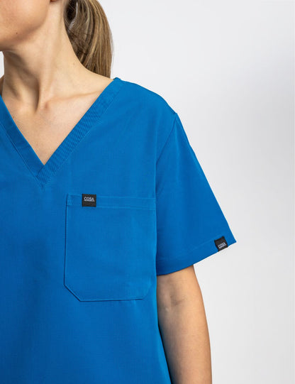 Female blue scrub top with pocket– Cosa Workwear